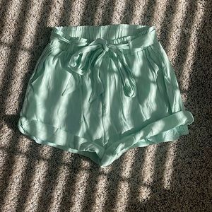 light green flowy shorts with belt and pockets